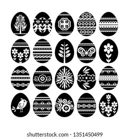 Silhouettes of black Easter eggs isolated on white background. Holiday Easter Eggs decorated with flowers and leafs. Print design, label, sticker, scrap booking, stamp, vector illustration