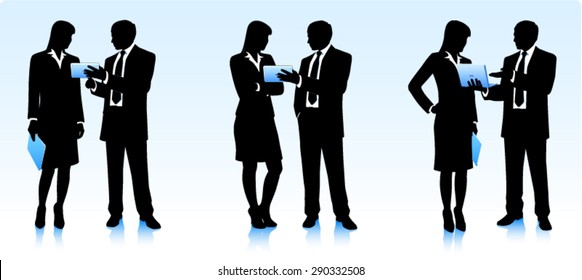 Silhouettes of businessmen with computers