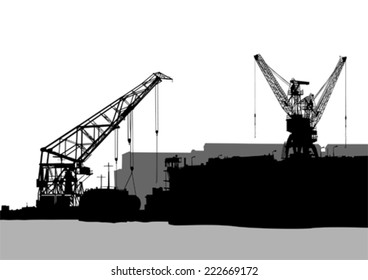 Silhouettes of cargo cranes in the seaport