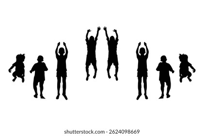 Silhouettes of children playing and jumping.Silhouette image of a group of children playing outdoors.