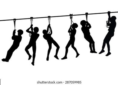 Silhouettes of children playing with a tyrolean traverse