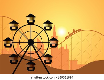 Silhouettes of a city and amusement park with the Ferris wheel