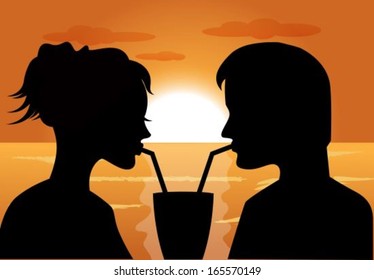 silhouettes of a couple in love at sunset drink from the same glass