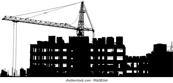 Silhouettes of crane near of building