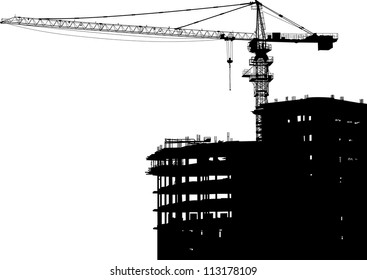 Silhouettes of crane on building