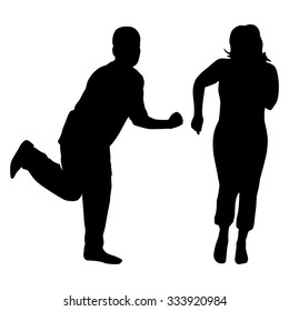 Silhouettes of dancing men and women. Vector illustration.