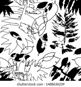 Silhouettes of different leaves on a white background. Seamless pattern of autumn leaves.