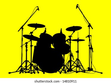 silhouettes of drums on a yellow background