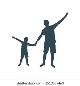 Silhouettes of father and child. Dad and son holding hands and spreading them apart as if flying like a plane. The boy was five years old.