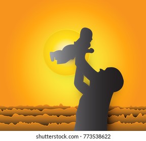 silhouettes of father and his son playing outside together the background is the sun falling on the sea paper art style