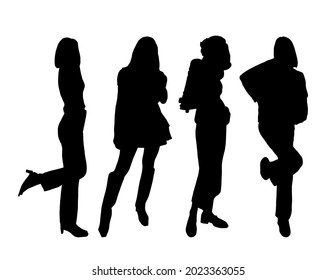 Silhouettes of four young flirty girls models posing in street style clothes. For printing and laser cutting. Vector illustration.