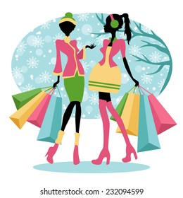 silhouettes of girls with shopping bags in winter