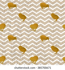 The silhouettes of gold chicks on grunge chevron background. Seamless pattern for Easter greeting card, print and web design.