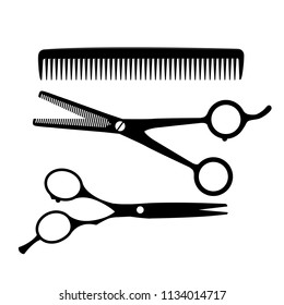 Silhouettes of hairdresser equipment - scissors and comb 