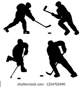 Silhouettes of Hockey players with Hockey puck and sticks. Vector illustration