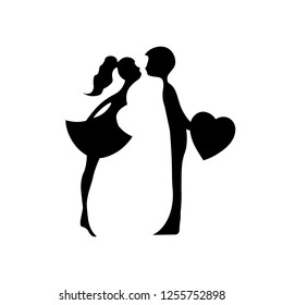 Silhouettes of kissing boy and girl. Kissing couple of young lovers . Romantic couple silhouette. Lovers woman and man kissing.