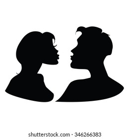 Silhouettes of kissing couple.