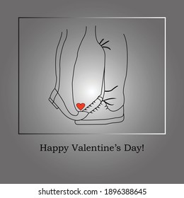 Silhouettes of the legs of a girl who raised herself on tiptoes and kisses a young man. It's Valentine's Day.