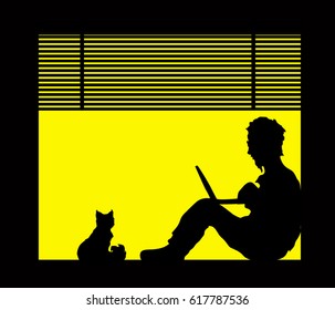 Silhouettes of man with a laptop and a cat are sitting on the window sill. Isolation and home quarantine for  people at coronavirus pandemiс. Work from home.