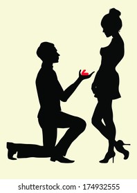 Silhouettes of a man proposing to a woman while standing on one knee. 