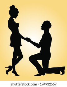 Silhouettes of a man proposing to a woman while standing on one knee. 