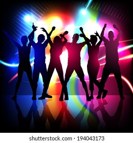 silhouettes of party people dancing on stage