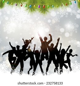 Silhouettes of people dancing on a Christmas background