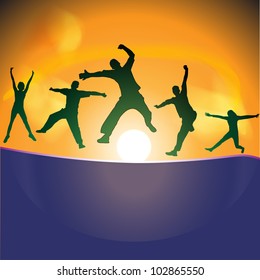 silhouettes of people jumping on the hill at sunset