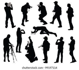 Silhouettes of people taking photos