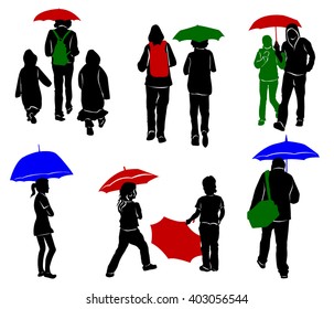 Silhouettes of people with umbrellas