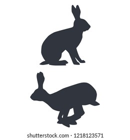 Silhouettes of sitting and jumping hares isolated on white background. Vector illustration EPS 8