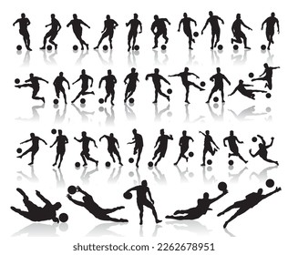 silhouettes of soccer players with the ball