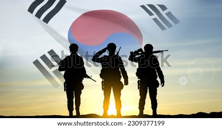 Silhouettes of a soldiers on background of sunset and flag of South Korea. Armed forces of South Korea concept. EPS10 vector