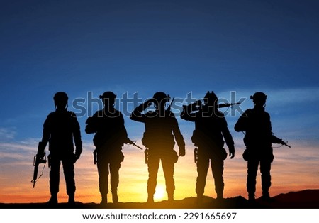 Silhouettes of a soliders against the sunset. EPS10 vector