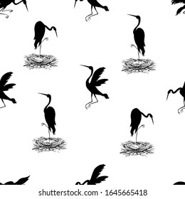 Silhouettes of storks. Seamless illustration. Vector illustration.