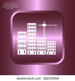 Silhouettes of three cranes working on the building