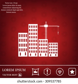 Silhouettes of three cranes working on the building