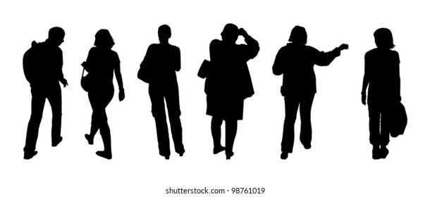 Silhouettes of tourists walking on excursion