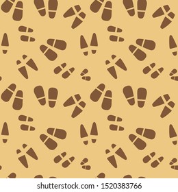 Silhouettes of traces of shoes . Footprints of human shoes. Vector Seamless pattern.