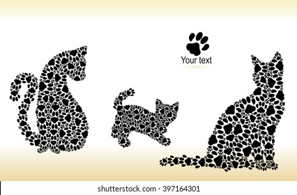 Silhouettes of two cats and a kitten from a black cat tracks