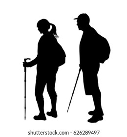 Silhouettes of two hikers with backpacks on white background