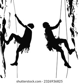 Silhouettes of two people climbing on mountain rock