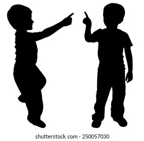 Silhouettes of two young boys showing something with finger