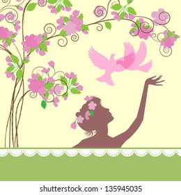 Silhouettes of  young  girl under a spring tree
