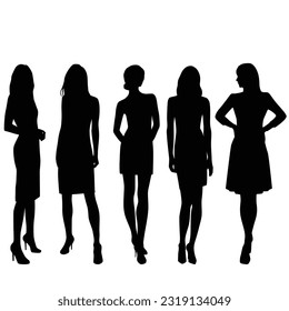 Silhouettes of young slender women, a group of standing business people, vector illustration, black color, isolated on a white background