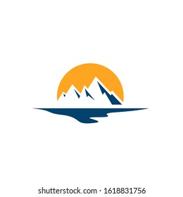 silhoutte of sunshine rising on the peak of mountain logo vector graphic concept