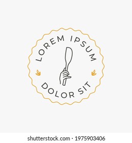 Silicon kitchen spatula in hand for baking logo design