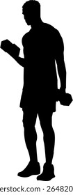 Sillhouette of strong man lifting weights in gym workout session