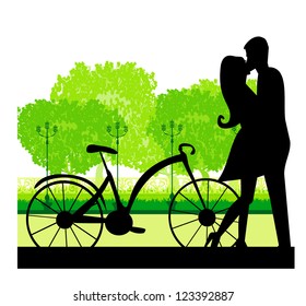 sillhouette of sweet young couple in love standing in the park