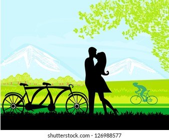  sillhouette of sweet young couple in love standing in the park
